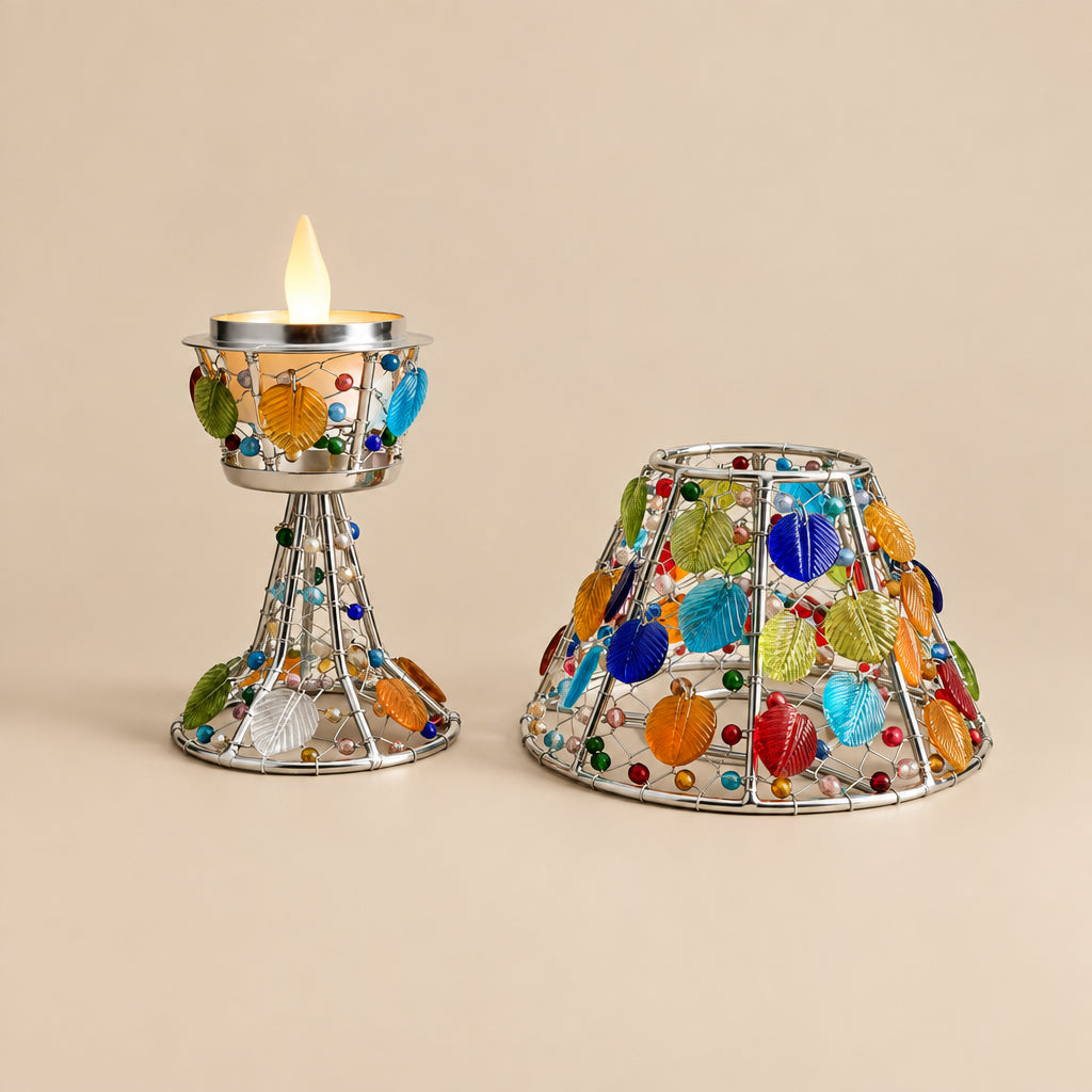 Decorative candle holders with colorful stones on a black background