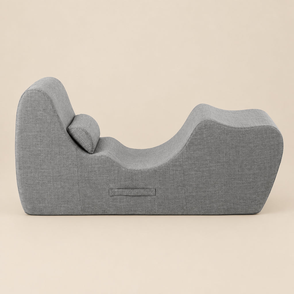 Gray textured curve lounge on a beige background