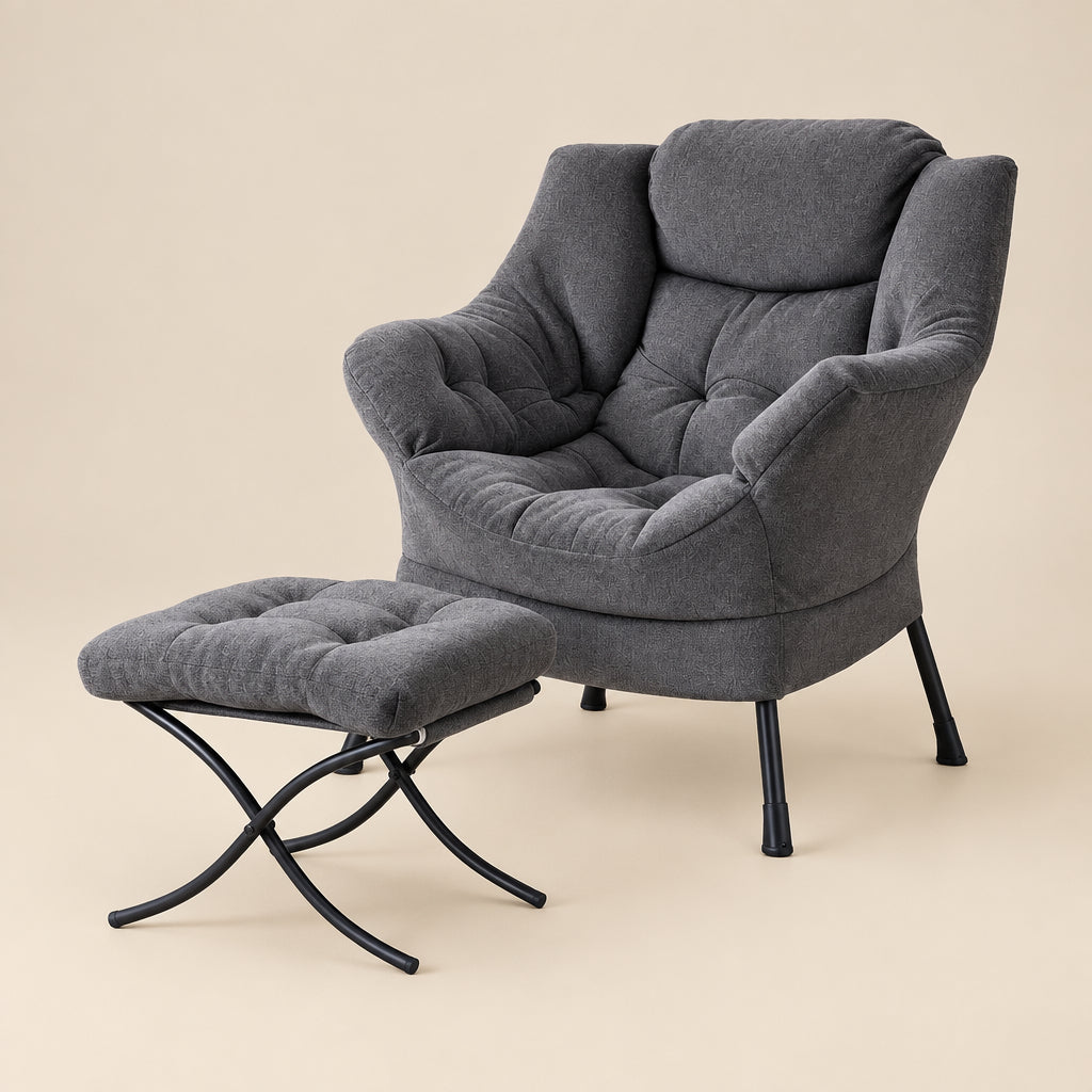 Gray armchair with matching ottoman on a white background