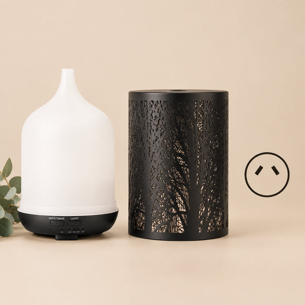 A diffuser set shown on a white background, featuring a white diffuser bottle with a black base next to a black cylindrical decorative sleeve with a tree silhouette pattern, plus a small inset showing the plug insert.