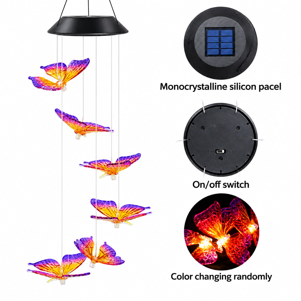 Solar-powered wind chime featuring five hanging monocry butterfly wings in purple and orange, with a black dome-shaped solar panel and text callouts showing the monocry staklines silicon pacel, on/off switch, and color changing randomly.