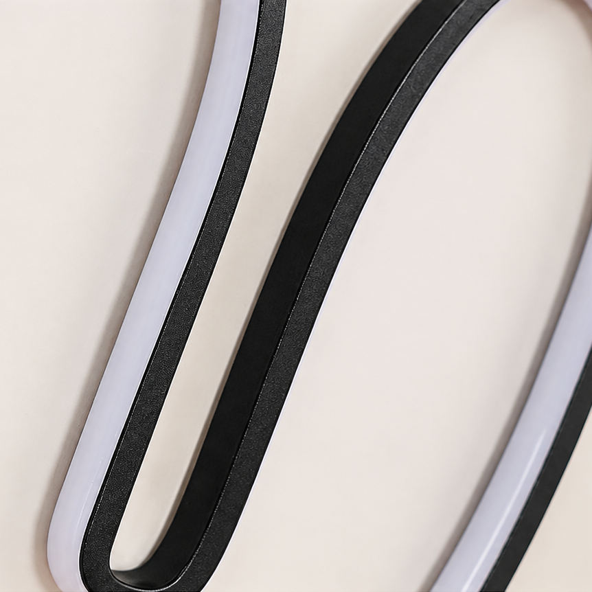 Close-up of a soft light-guiding silicone strip on a white background
